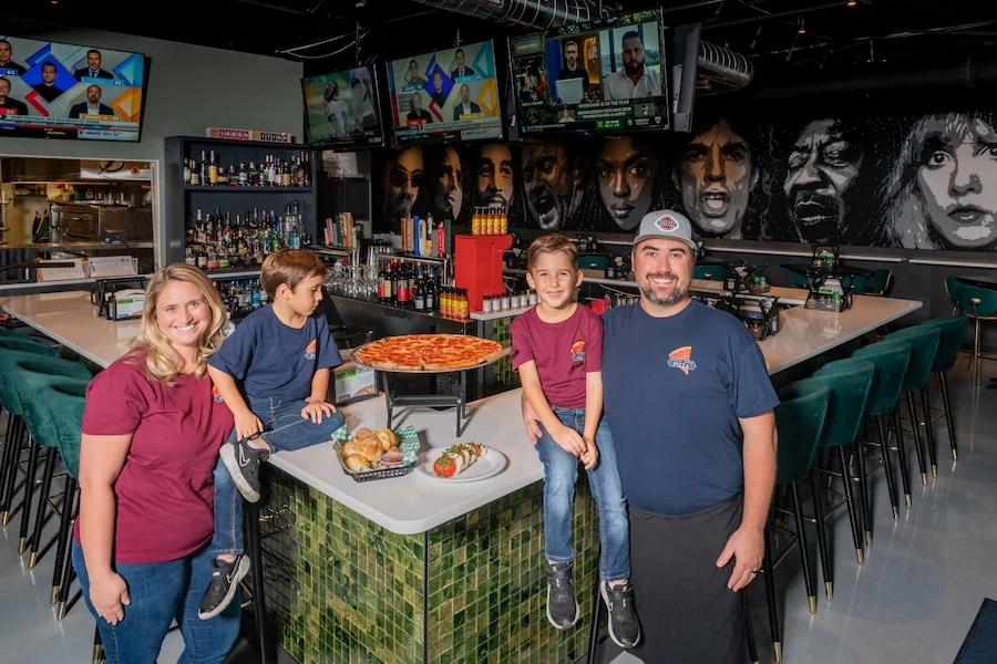 Sean and Jackie Ferraro with their twin sons Johnny and Ryan at Madison Avenue Pizza